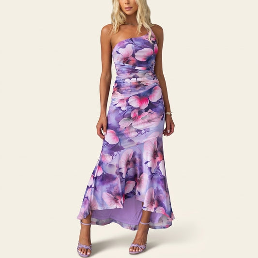 Woman wearing Drapelia floral one-shoulder maxi dress with botanical print
