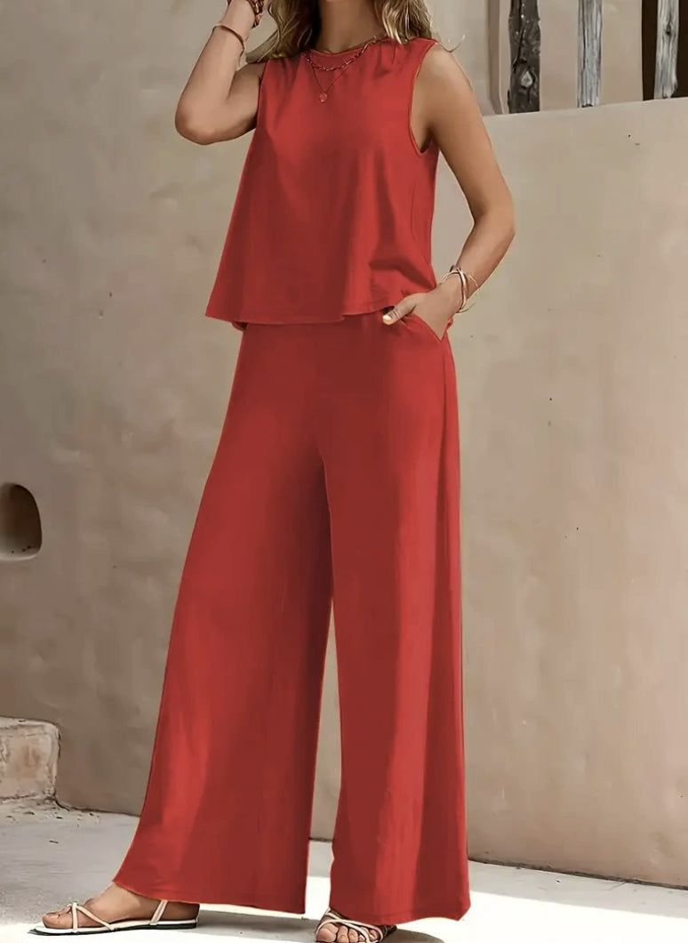 Woman wearing Drapelia sleeveless top and wide pants set in a solid color