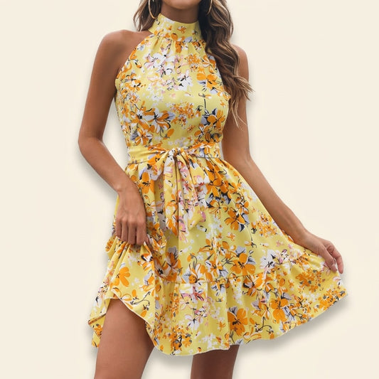 Woman wearing Drapelia floral halter ruffle dress with lace-up neckline