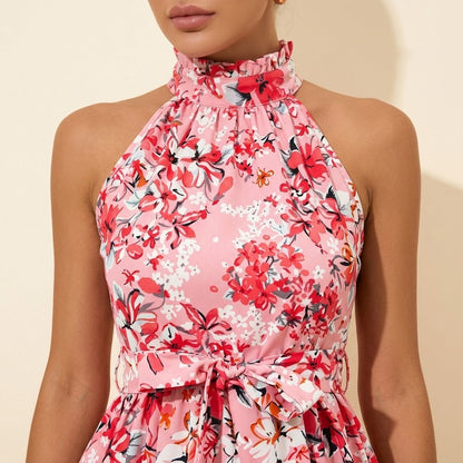Woman wearing Drapelia floral halter ruffle dress with lace-up neckline