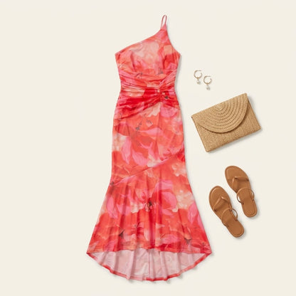 Woman wearing Drapelia floral one-shoulder maxi dress with botanical print