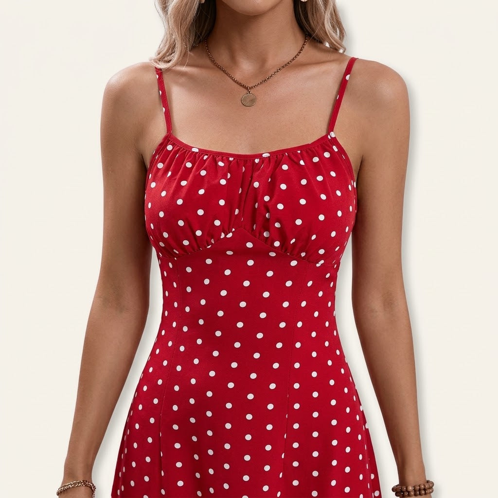 Woman wearing Drapelia polka dot slip maxi dress with side slit
