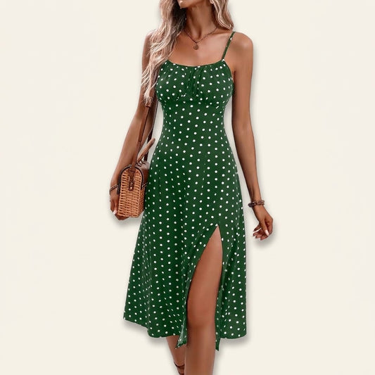 Woman wearing Drapelia polka dot slip maxi dress with side slit