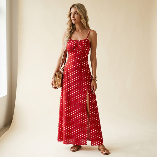 Woman wearing Drapelia polka dot slip maxi dress with side slit