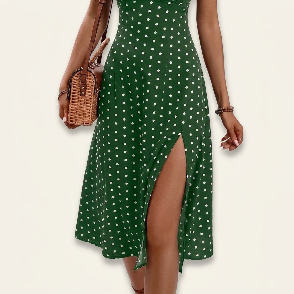 Woman wearing Drapelia polka dot slip maxi dress with side slit